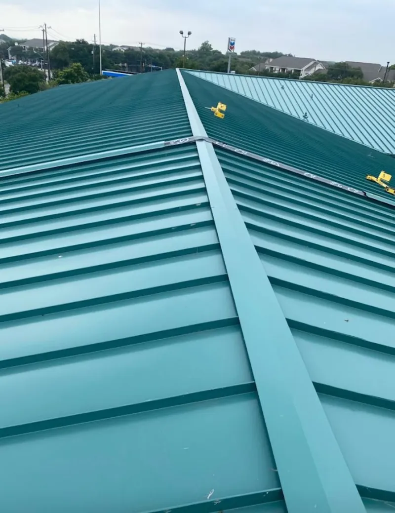 Green commercial metal roof ridge and valley for Metal Roof Repair in Falmouth